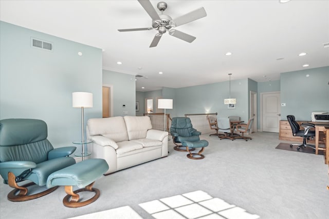 living room featuring light carpet and ceiling fan