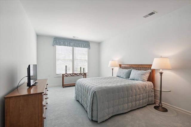 bedroom featuring light carpet