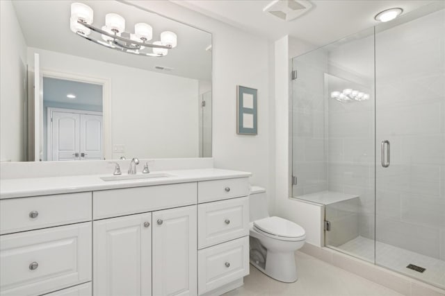 bathroom with vanity, an enclosed shower, toilet, and tile patterned flooring