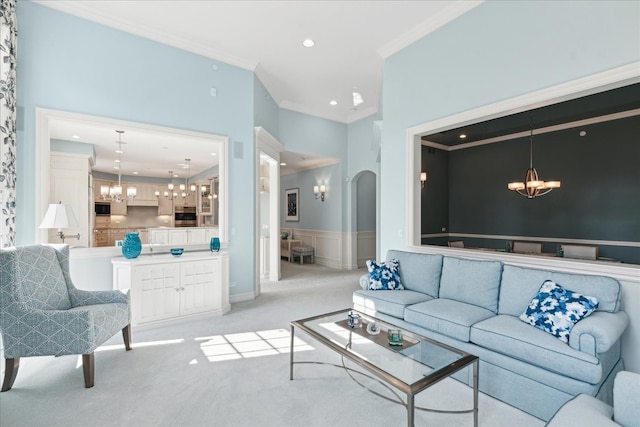 carpeted living room with ornamental molding