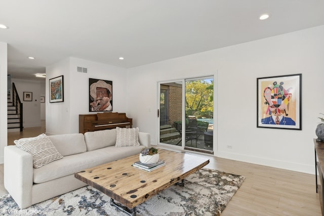 living room with light hardwood / wood-style floors