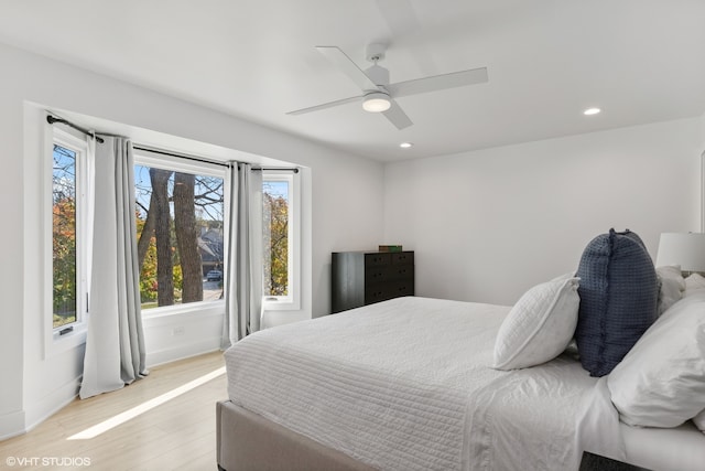 bedroom featuring light hardwood / wood-style floors and ceiling fan