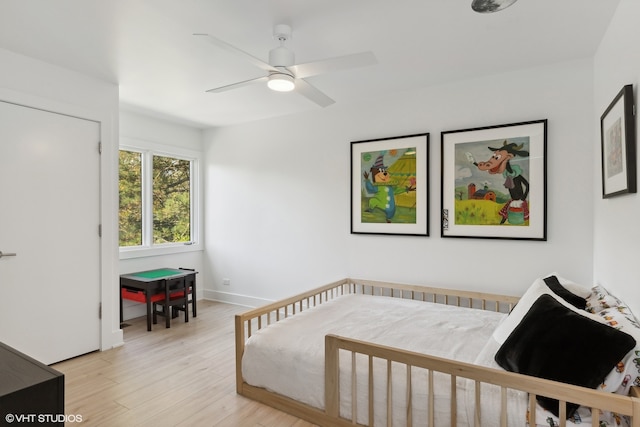 bedroom featuring light hardwood / wood-style flooring and ceiling fan