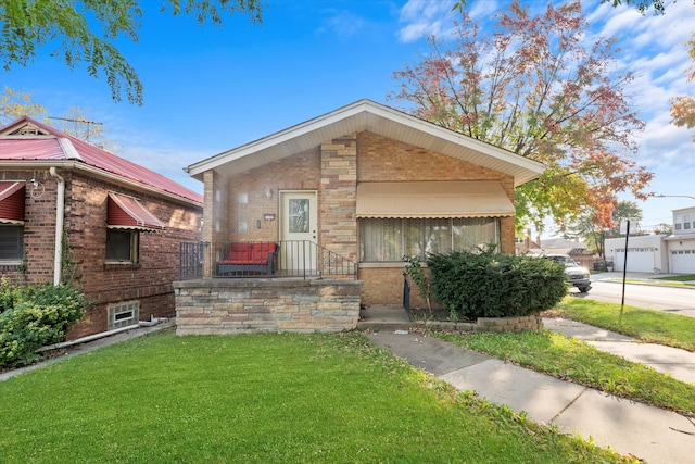 bungalow with a front lawn and a garage