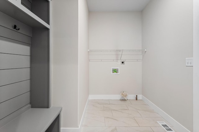 laundry area featuring visible vents, hookup for an electric dryer, baseboards, laundry area, and marble finish floor