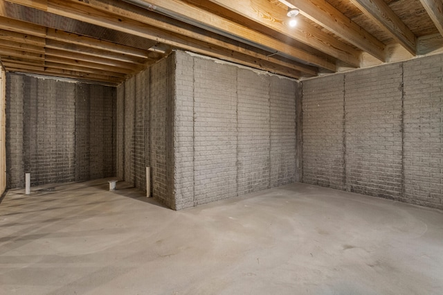 unfinished basement with brick wall