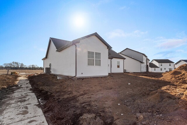view of property exterior with central AC