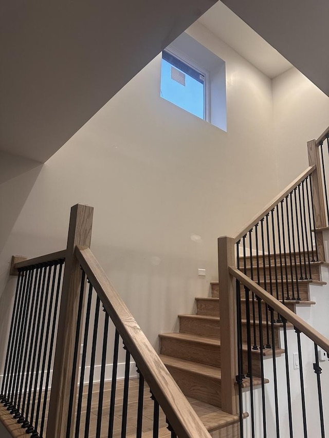 stairway with wood-type flooring