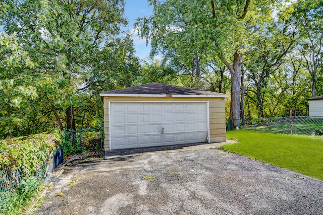 garage featuring a lawn