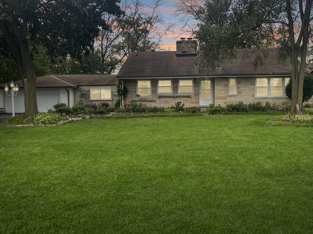 2521 Seminary Ave, Des Plaines, IL 60016 - view of front facade featuring stone siding, a chimney, a lawn, and a garage