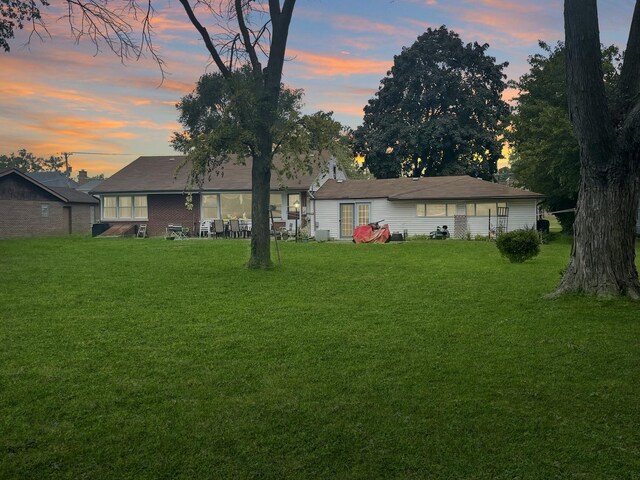 2521 Seminary Ave, Des Plaines, IL 60016 - back of property at dusk with a yard