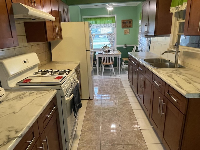 2521 Seminary Ave, Des Plaines, IL 60016 - kitchen with gas range gas stove, under cabinet range hood, backsplash, and ceiling fan