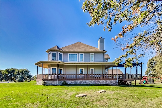 back of house with a porch and a lawn