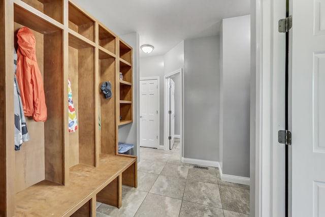 mudroom with light tile patterned floors