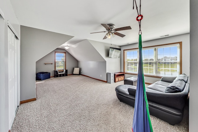 additional living space with ceiling fan, vaulted ceiling, and carpet