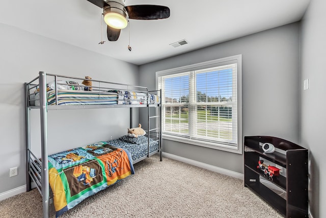 carpeted bedroom featuring ceiling fan