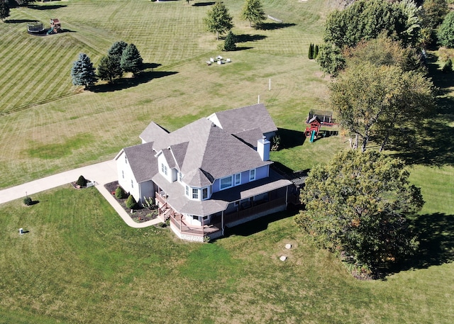 birds eye view of property with a rural view