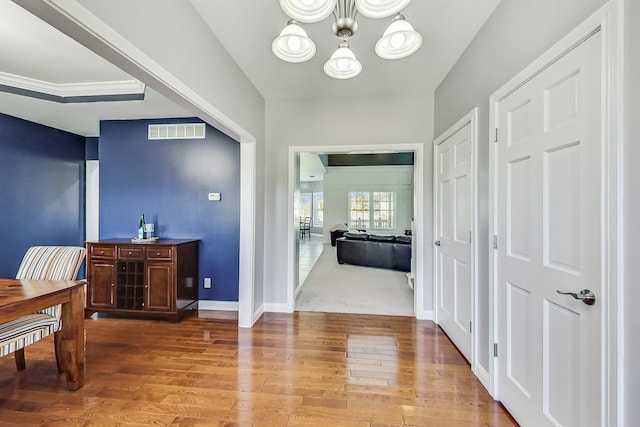 interior space featuring an inviting chandelier and hardwood / wood-style floors