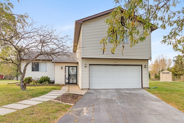 view of front of home featuring a garage, a front lawn, and a storage unit