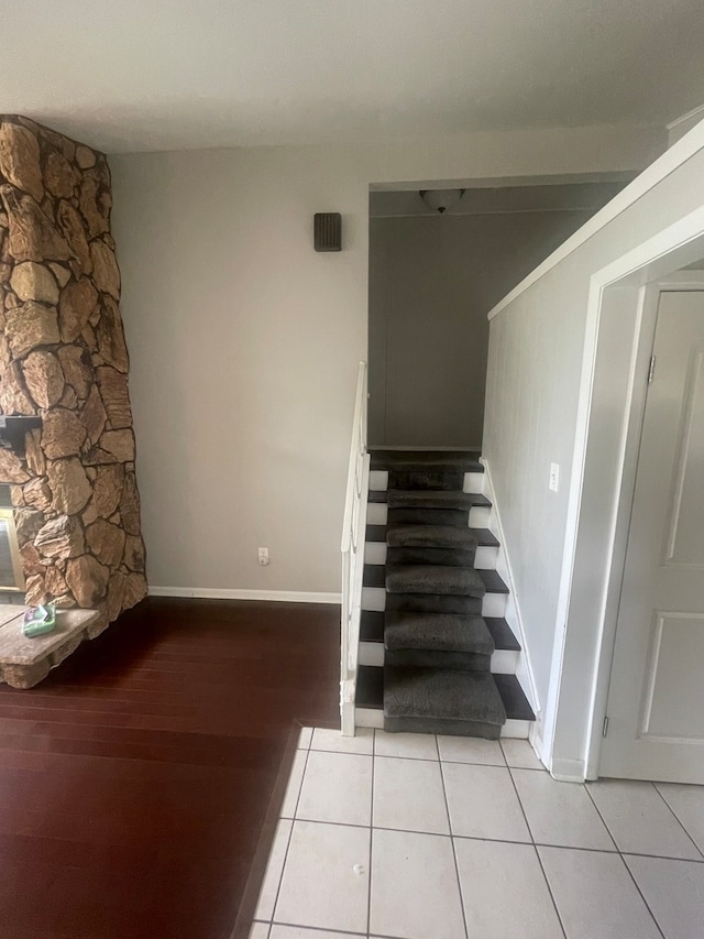 staircase with hardwood / wood-style floors