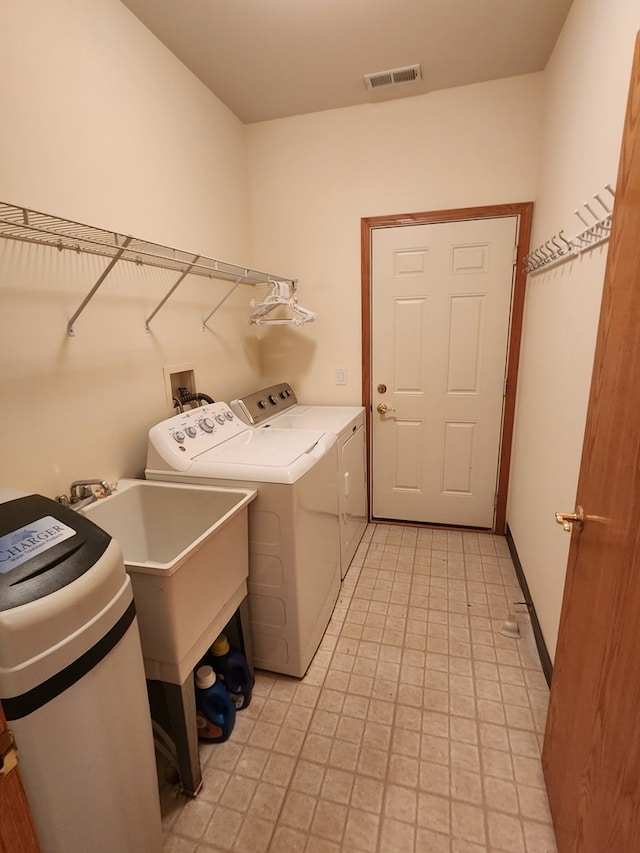 laundry room featuring washer and clothes dryer