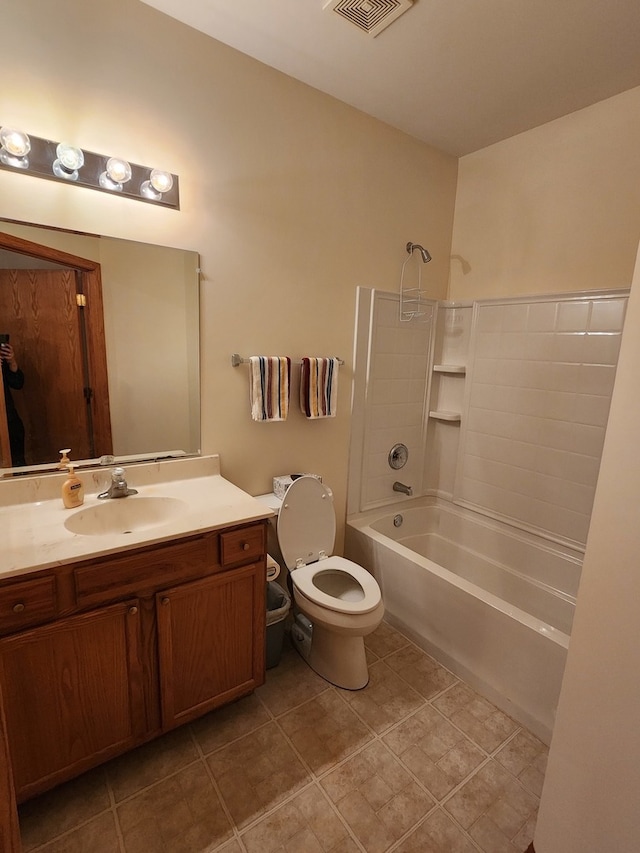 full bathroom with toilet, vanity, tile patterned flooring, and shower / washtub combination