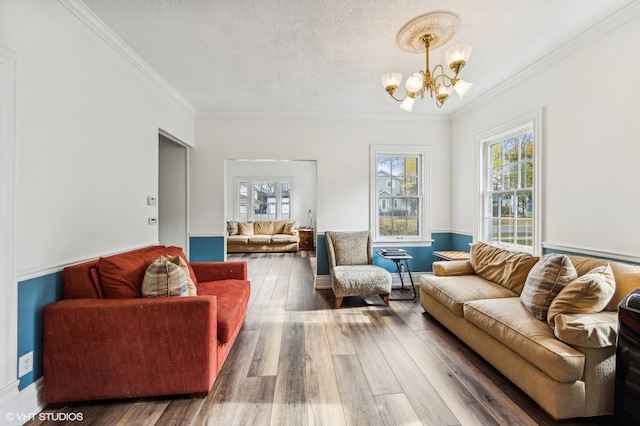 living room featuring crown molding, a healthy amount of sunlight, and dark hardwood / wood-style flooring