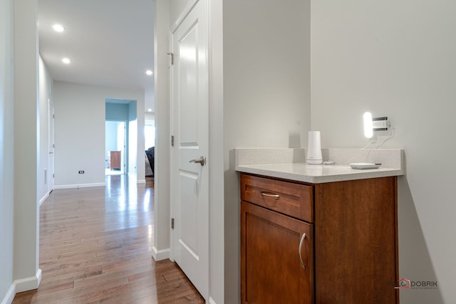 bathroom with vanity and hardwood / wood-style flooring