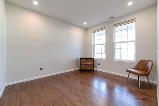 unfurnished room featuring dark hardwood / wood-style flooring