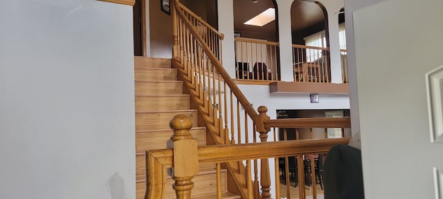 stairs with a skylight