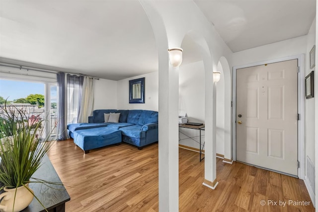 living room with light hardwood / wood-style flooring