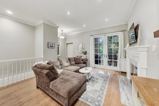 living room with french doors, light wood-type flooring, and crown molding