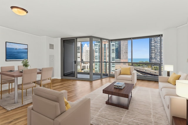 living room featuring hardwood / wood-style flooring and expansive windows