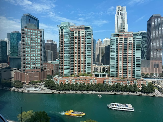 property's view of city featuring a water view