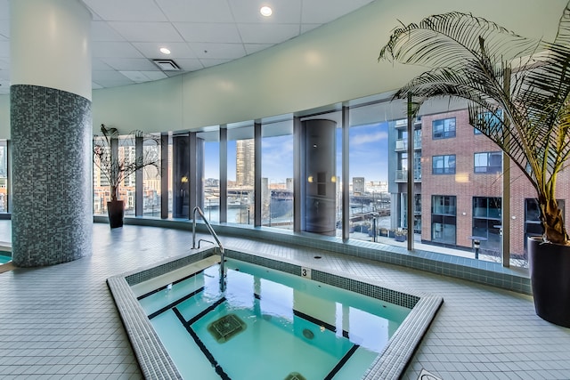 view of pool featuring an indoor hot tub