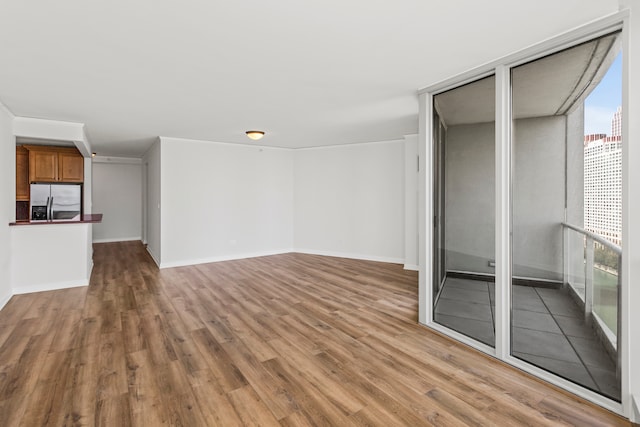 unfurnished living room with hardwood / wood-style floors