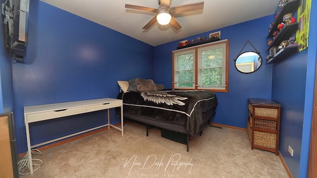 carpeted bedroom with ceiling fan