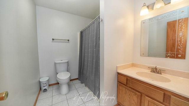 bathroom with tile patterned floors, a shower with shower curtain, vanity, and toilet