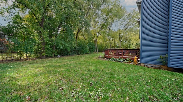 view of yard with a wooden deck