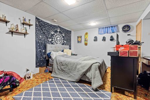 bedroom featuring a drop ceiling