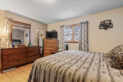 bedroom with light hardwood / wood-style floors