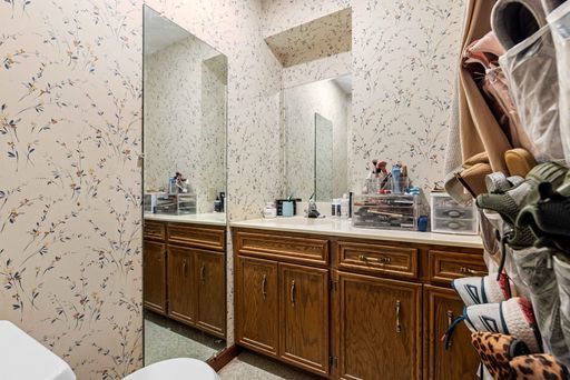 bathroom featuring toilet and vanity