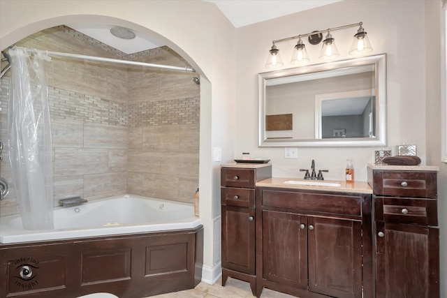 bathroom with tile patterned flooring, shower / bath combo with shower curtain, and vanity