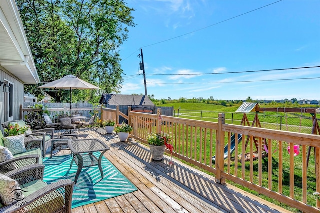 deck featuring a lawn