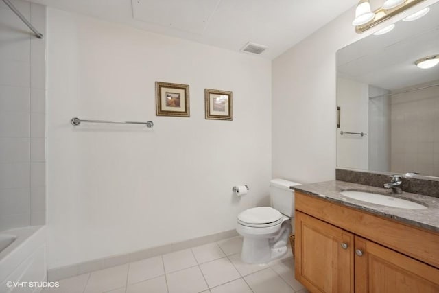 bathroom featuring tile patterned flooring, vanity, and toilet