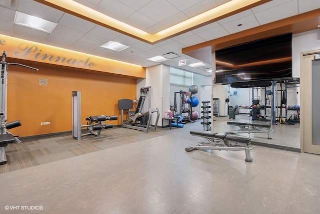 workout area featuring a drop ceiling