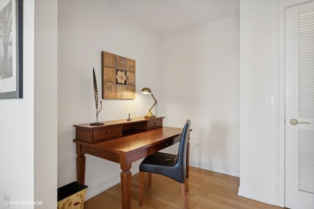 office space with light hardwood / wood-style flooring