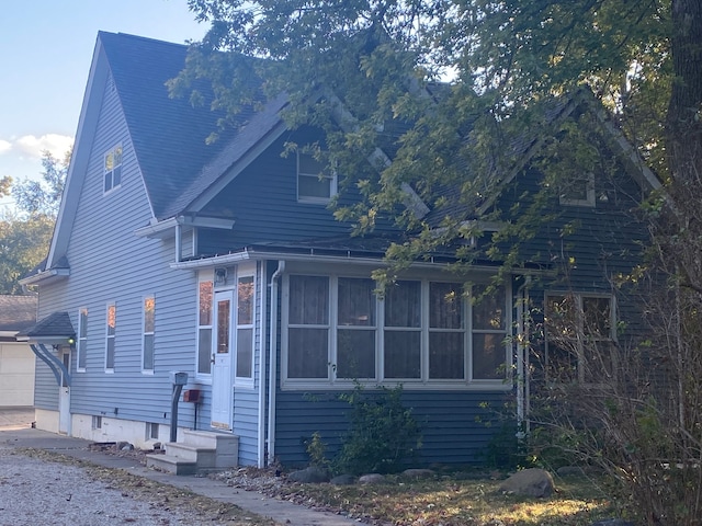 view of property exterior with a garage