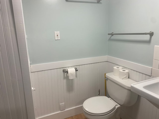 bathroom featuring toilet and tile patterned floors