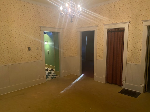 interior space featuring a notable chandelier and carpet flooring